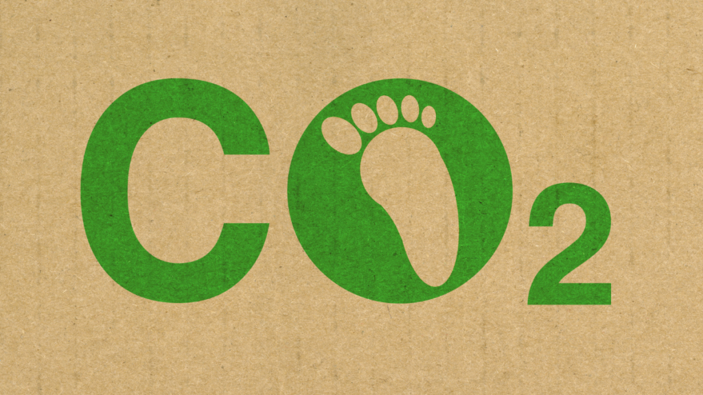 Texte : CO2, avec une trace de pied dans le O
