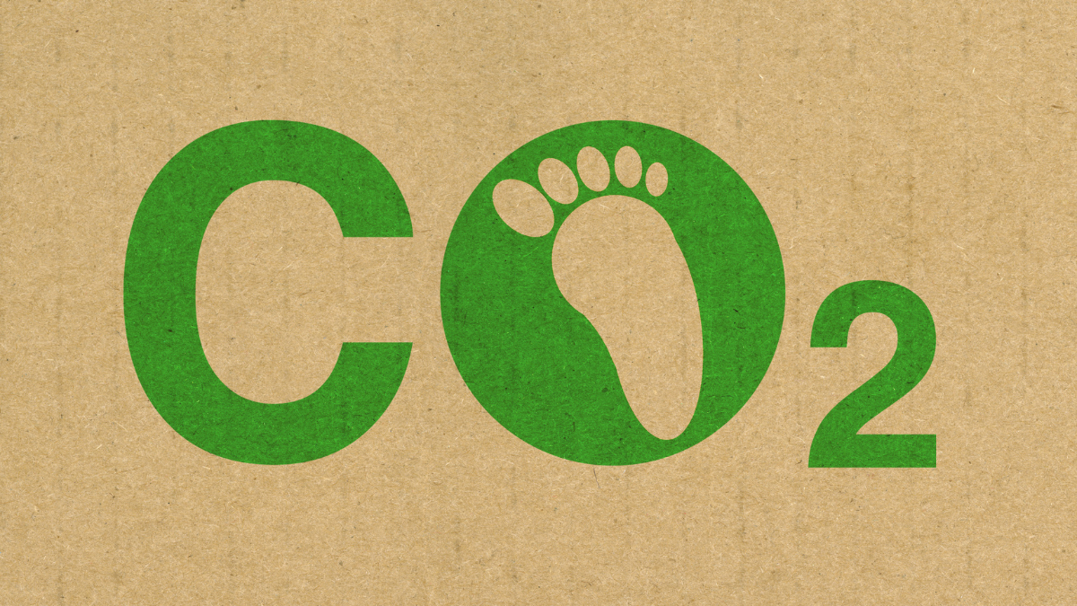 Texte : CO2, avec une trace de pied dans le O